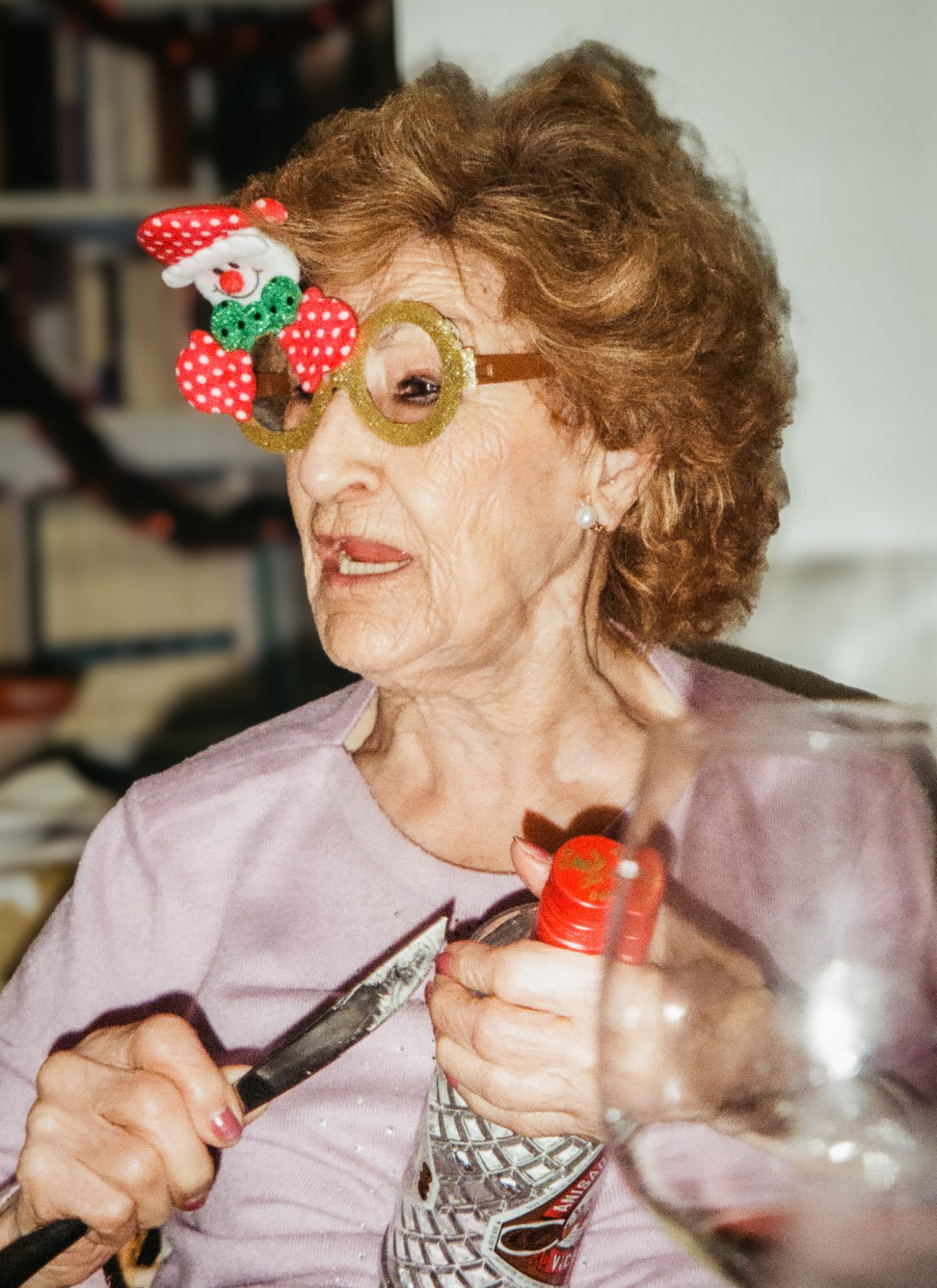 A woman talking, in novelty glasses