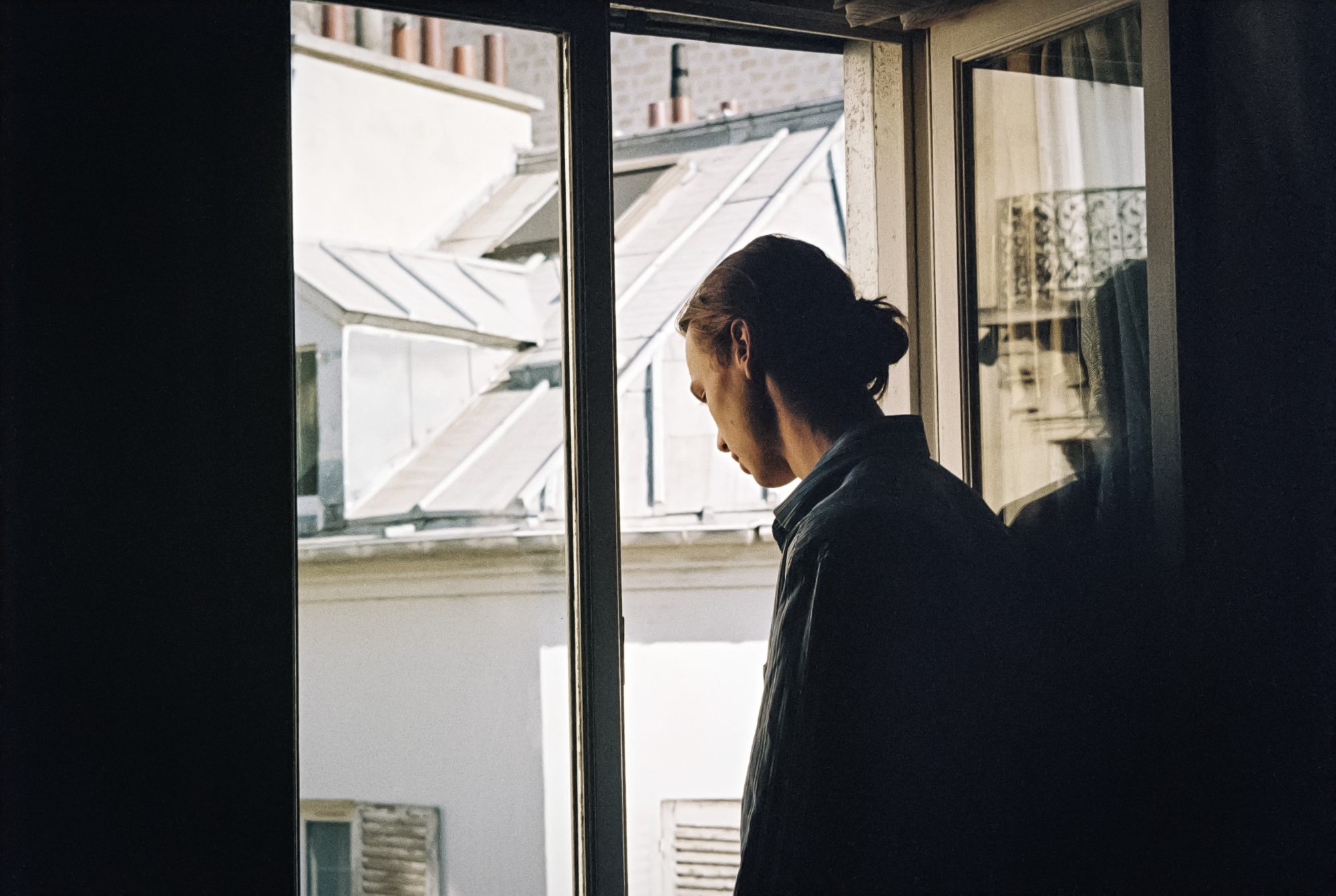 At the window, looking down